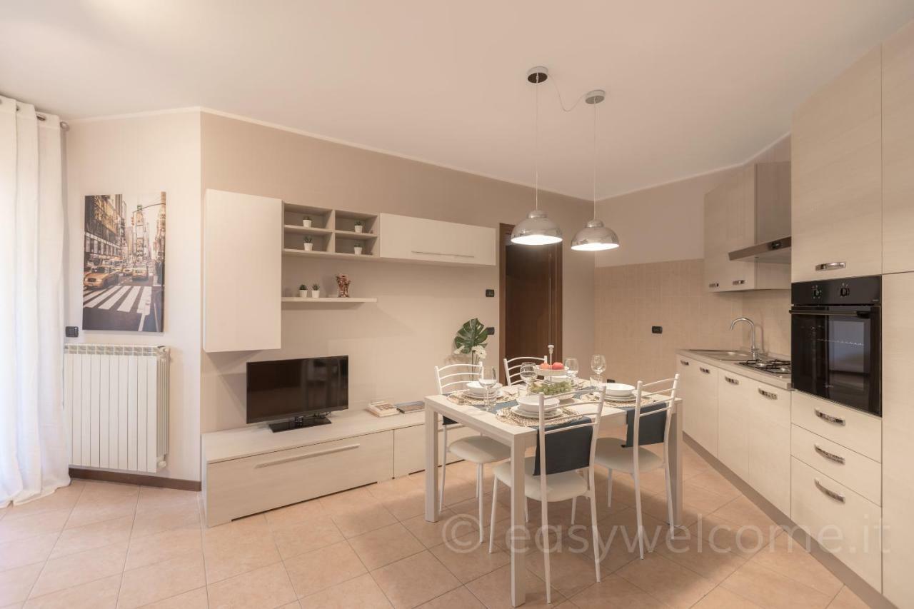 Easy Welcome Casa Rosada Apartment Nova Milanese Bagian luar foto